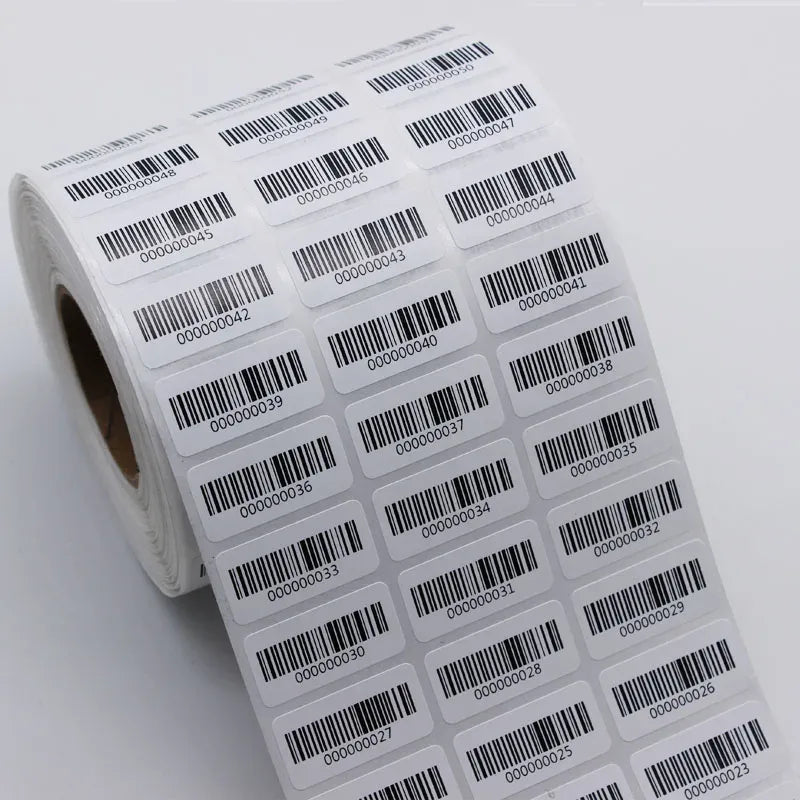 Rolled roll of barcode number labels, black barcodes on white adhesive sheets.