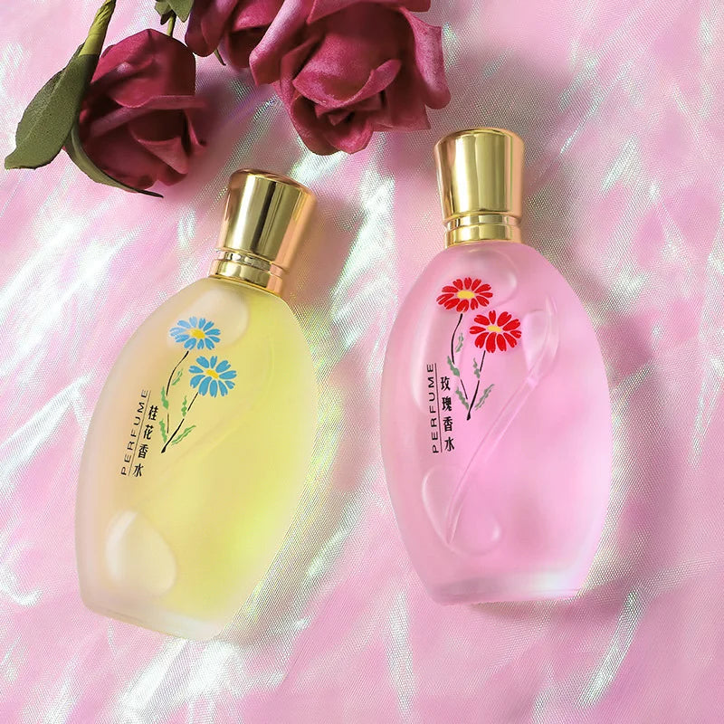 Women's Osmanthus & Gardenia EDP 50ml perfume set. Oval glass floral bottles with gold caps on a pink silky background.