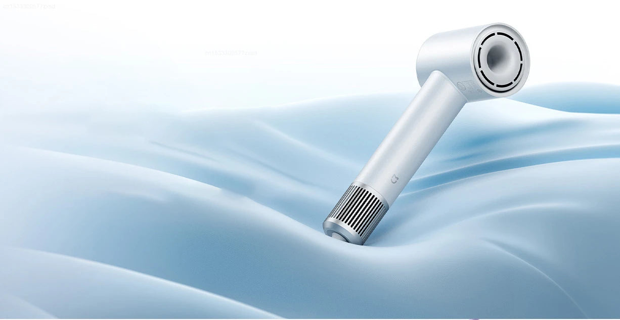 White Mijia H501 high-speed negative ion hair dryer with sleek, minimalist design on blue fabric background.