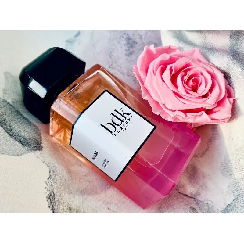 BDK Parfums Impadia EDP 100ml: Luxurious women's perfume in a rectangular glass bottle with black cap and pink rose.