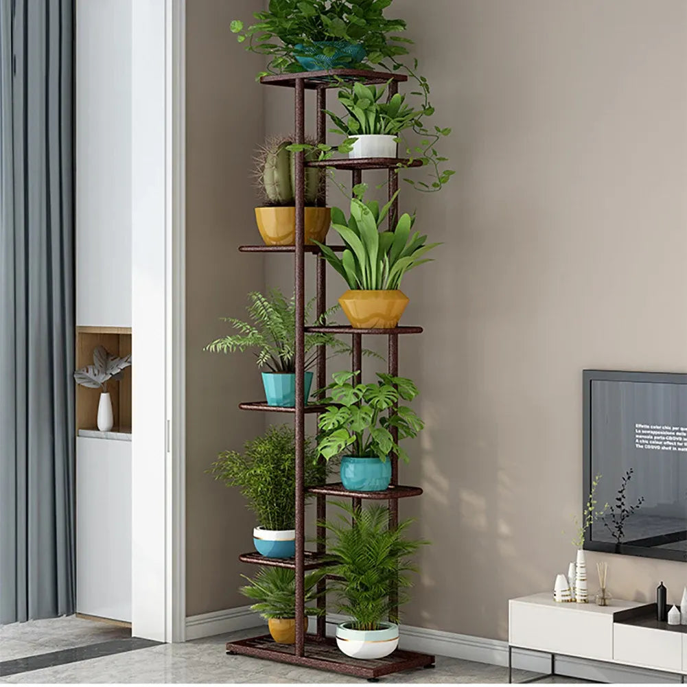 Multi-layer plant display shelf with dark copper frame and round tiers, holding potted plants