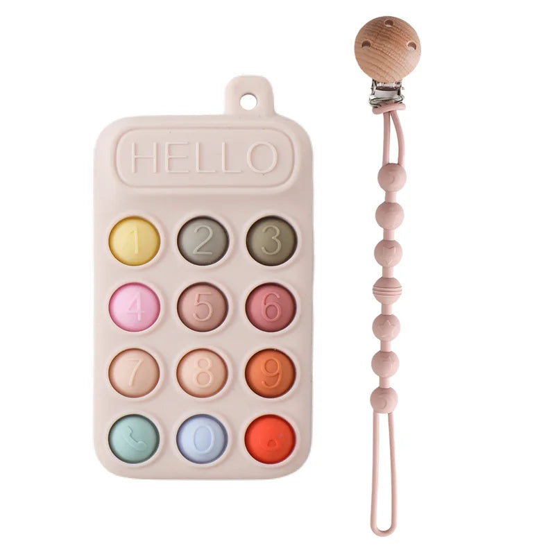 Pink silicone phone baby teething toy with multi-color buttons and wooden pacifier clip for soothing infants.