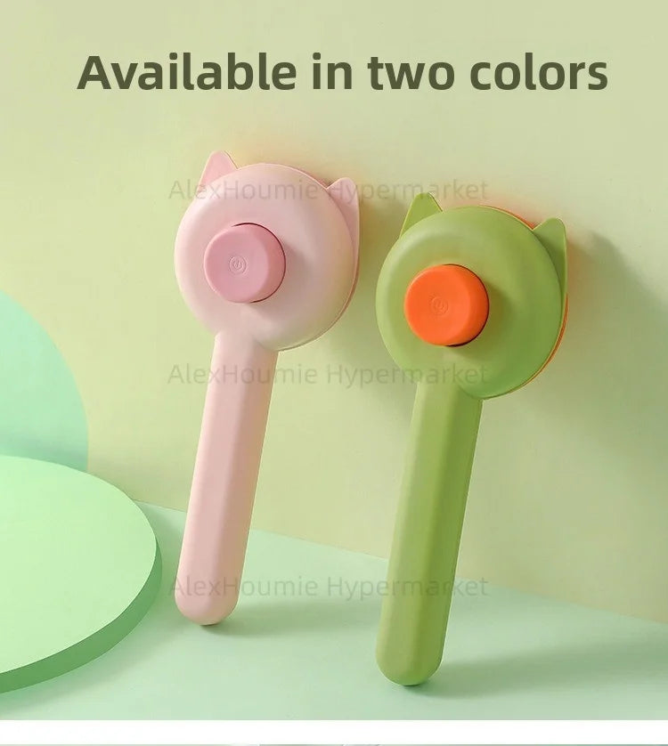 Two cat-shaped grooming brushes in pink and green for removing pet hair and shedding from cats and kittens.