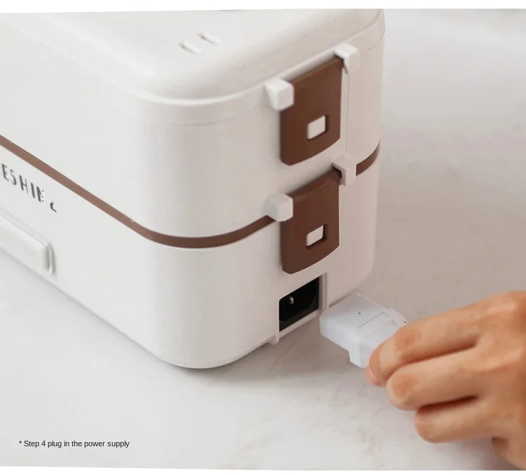 Portable electric heating lunch box with side power plug being connected
