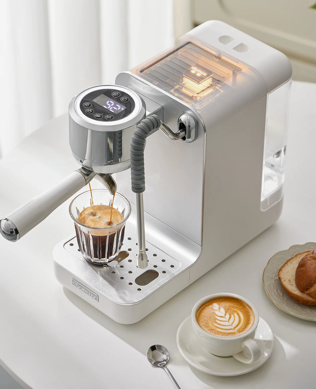 Couplux white espresso machine with digital temperature display, chrome accents, and steaming wand brewing coffee.
