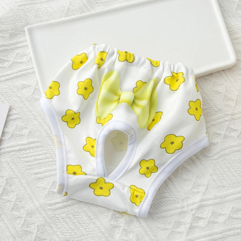 Reusable white floral pet diaper for small dogs. Washable sanitary panties with a cute bow for heat and incontinence.