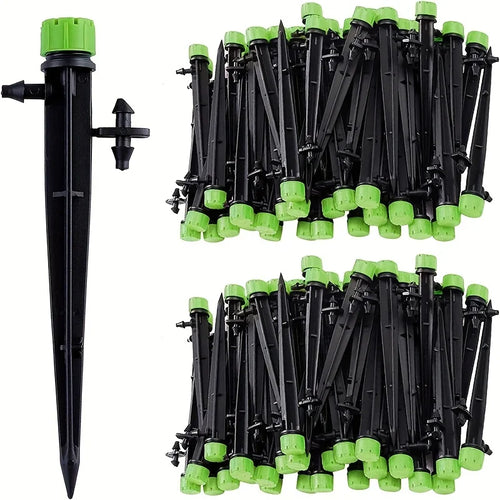 Set of black drip emitter stakes with green tops, bundled for irrigation