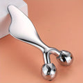Silver metallic 2-in-1 facial tool with a smooth gua sha handle and two faceted, Y-shaped rolling massage spheres.
