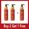 Three amber-colored pump bottles of Magic Luxury Body Oil with a "Buy 2 Get 1 Free" offer on a red background.