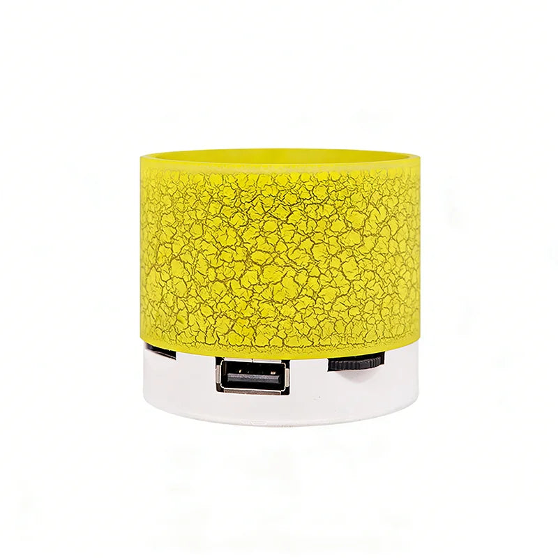 Portable wireless Bluetooth speaker, yellow cylinder with USB port and strap control area