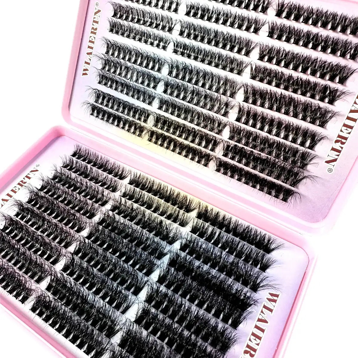 Rows of black synthetic individual eyelash clusters arranged in a two-part pink storage case.