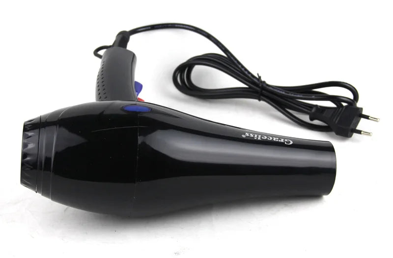 Black professional salon hair dryer with EU plug, hot and cold wind settings, and ergonomic handle for home use.