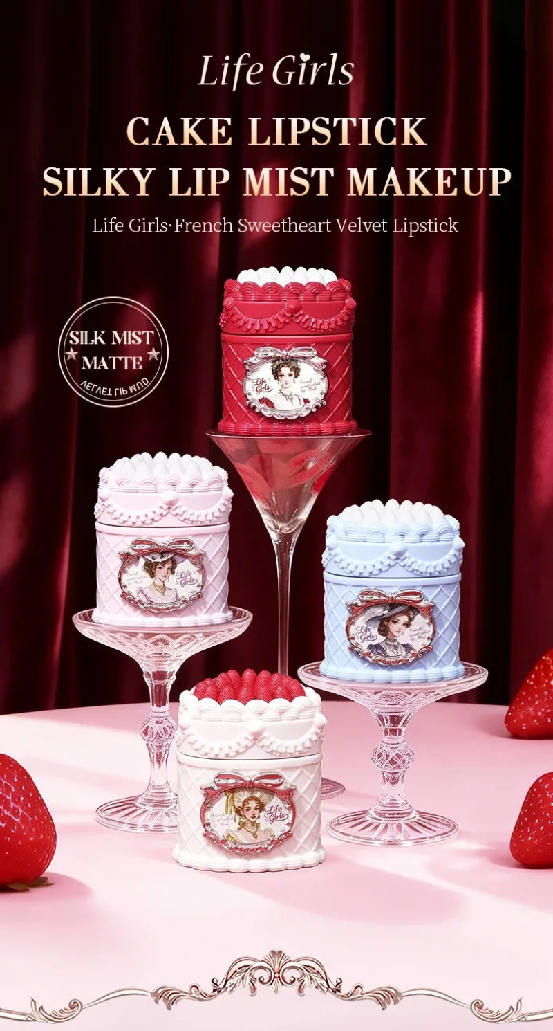 Vintage-style strawberry cake lip mud containers with a soft-focus matte velvet finish in various pastel colors.