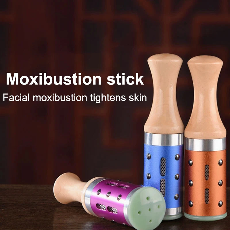 Warm jade facial moxibustion sticks with wooden handles for hot compress skin tightening and beauty massage therapy.