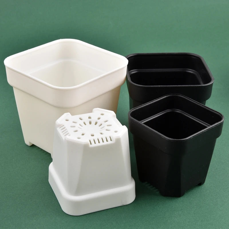 Square flower pots with drainage inserts in white and black, set of four