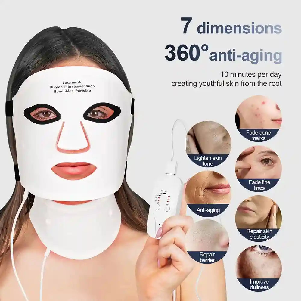 A person wearing a flexible, white silicone LED mask covering the face and neck, with a handheld power controller.