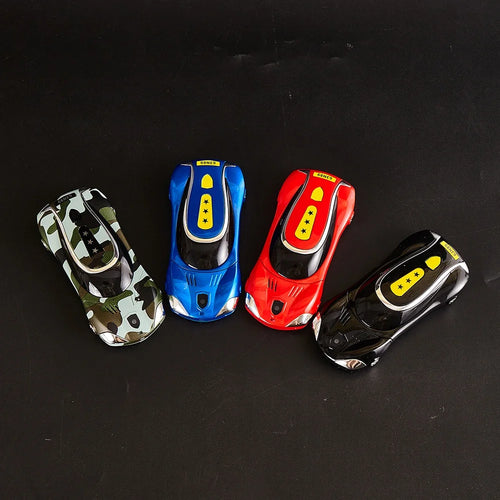 Top view of camo, blue, red, and black luxury car-shaped mini GSM mobile phones with dual SIM Bluetooth dialer.