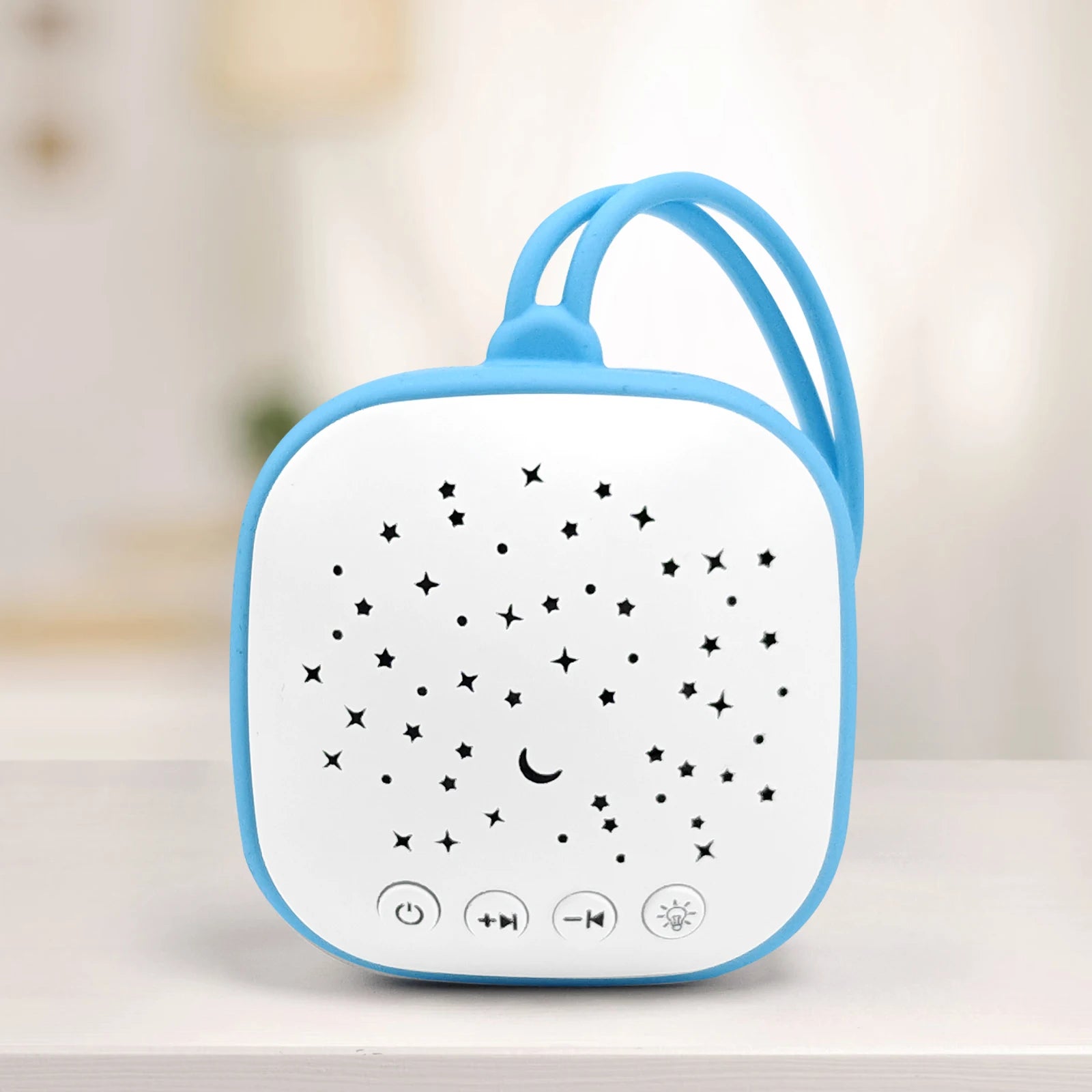 Blue and white portable sleep aid and sound machine with star projector and four control buttons.