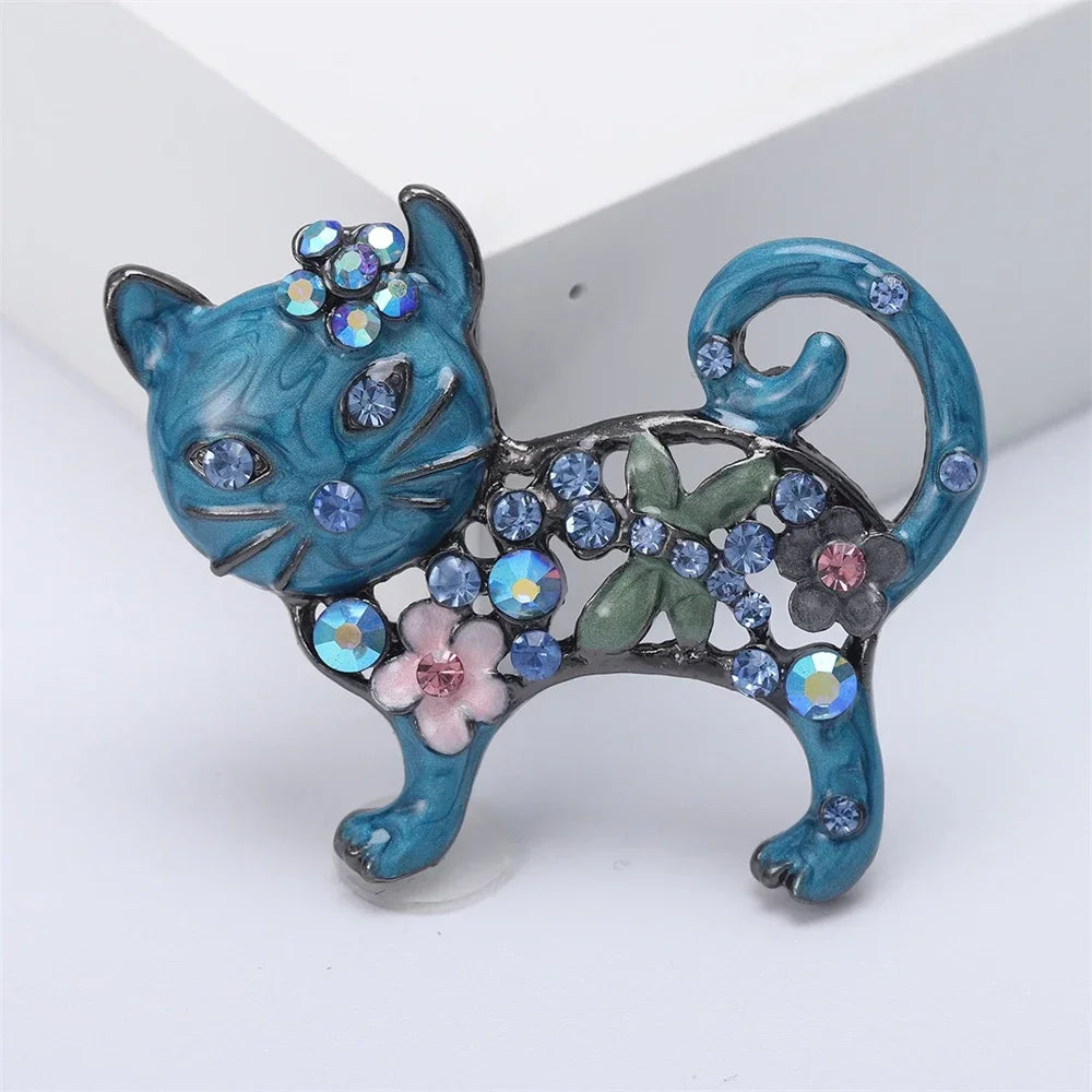 Sparkling blue enamel cat brooch with crystals, a perfect floral lapel pin gift for pet lovers to accessorize outfits.