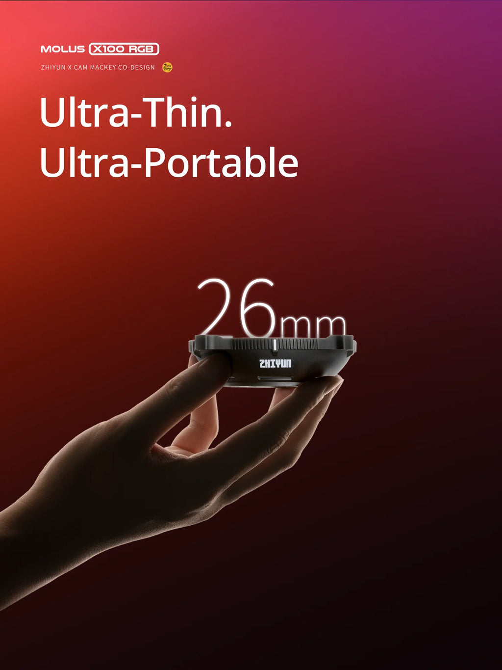 A hand holding a thin, black, circular LED light accessory, 26mm in size, for portable photography lighting.