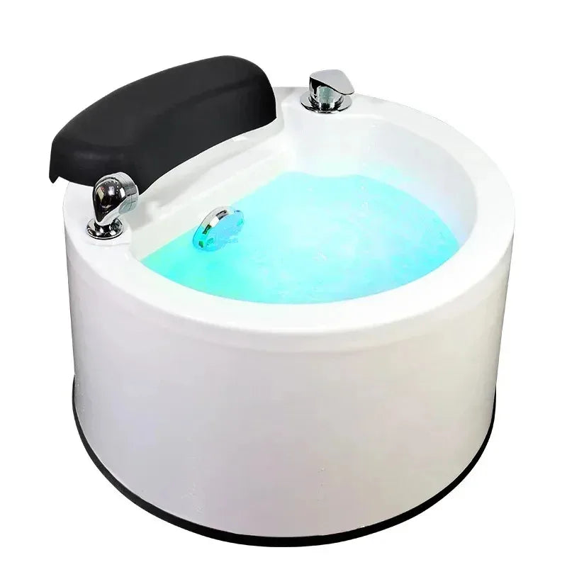 White hydro-massage foot spa base with black headrest and chrome jet nozzles