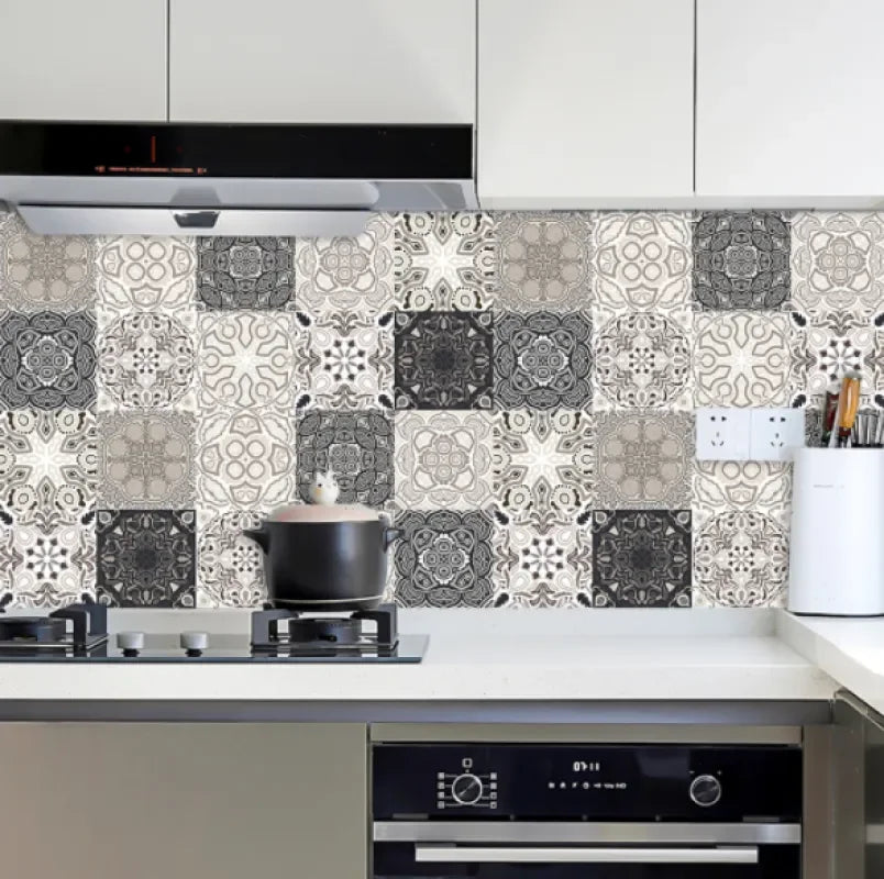 Mosaic tile wall decal sheet behind stove, gray and white Moroccan patterned tiles
