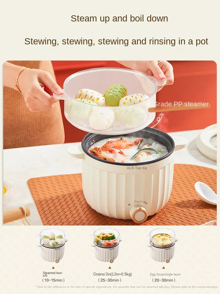 Electric rice cooker with steamer basket and glass lid over steaming food