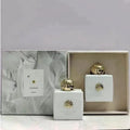 Amouage Honour Woman EDP: White square luxury perfume bottle with gold cap, elegant floral oriental Arabian fragrance.