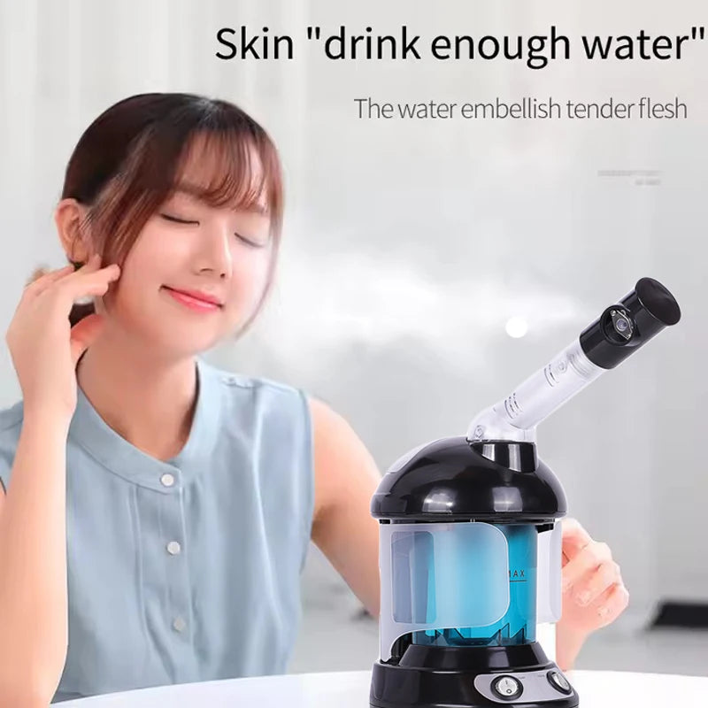Woman using a portable black and blue nano facial steamer for deep pore cleansing and spa-like skin hydration.