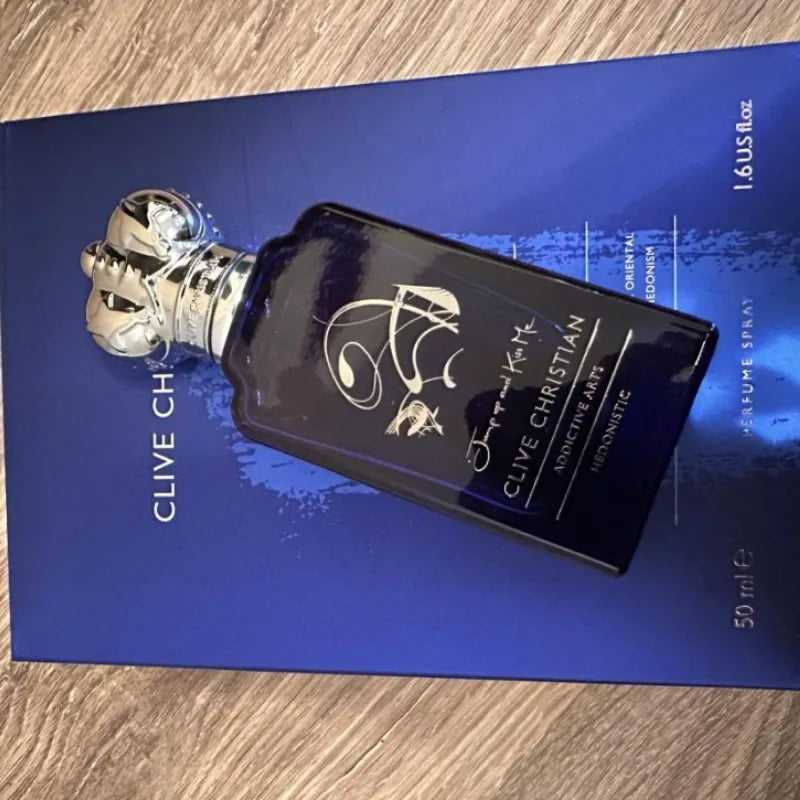 Clive Christian Jump Up and Kiss Me EDP: Unisex oriental floral woody amber tobacco scent in luxury crown-capped bottle.
