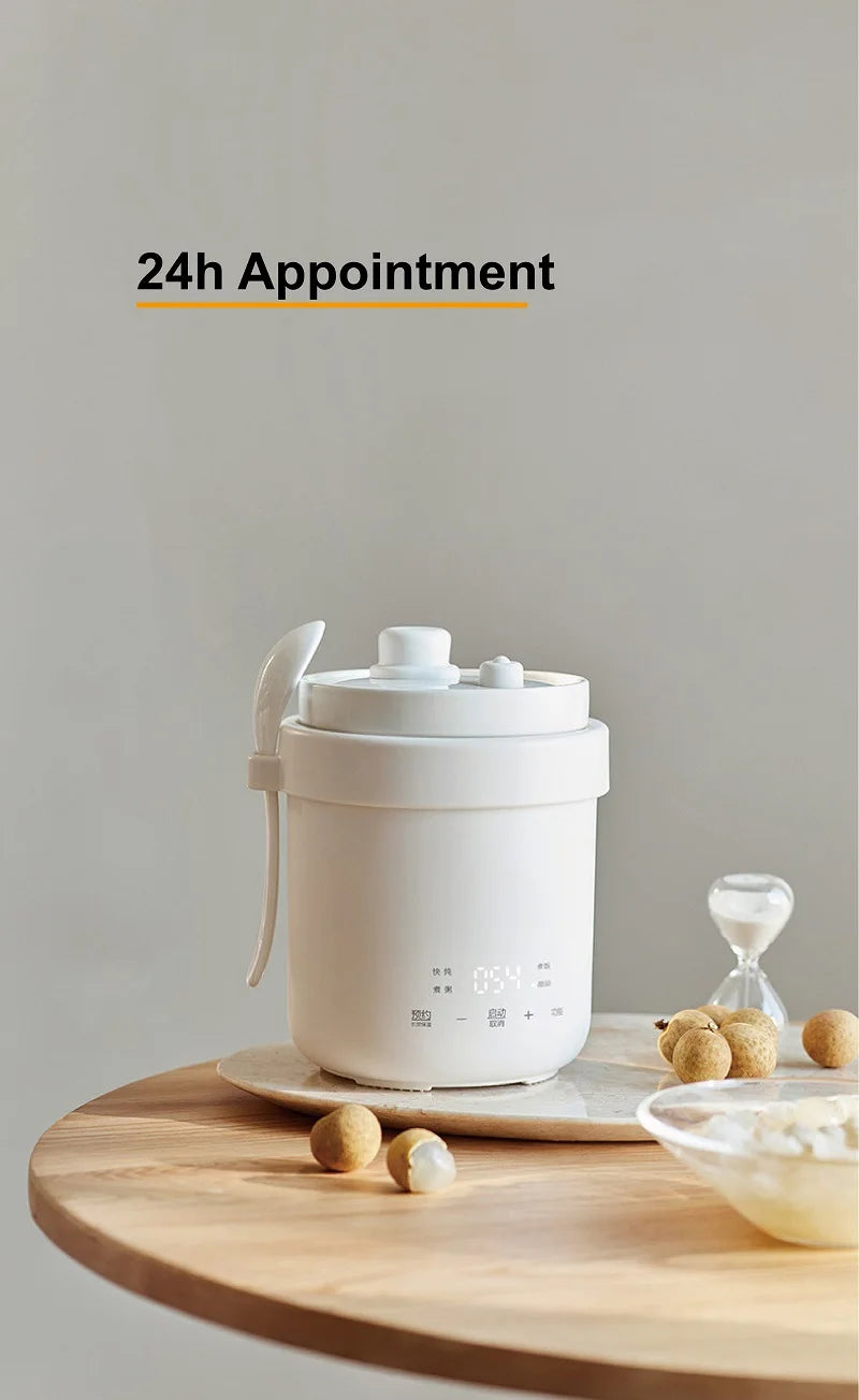 White 600ml electric stew pot with lid and loop handle for carrying