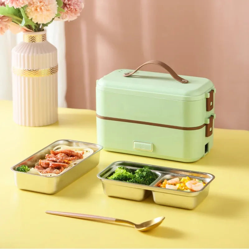 Portable electric heating lunch box, mint green with brown trim and open meal trays.