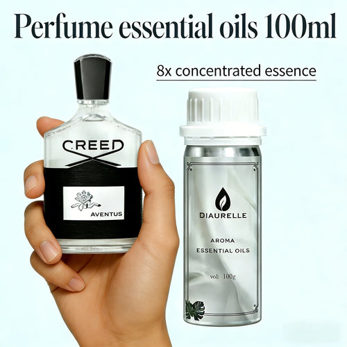 Hand holding Creed Aventus perfume and Diaurelle silver 100ml essential oil bottle for aromatherapy wellness.