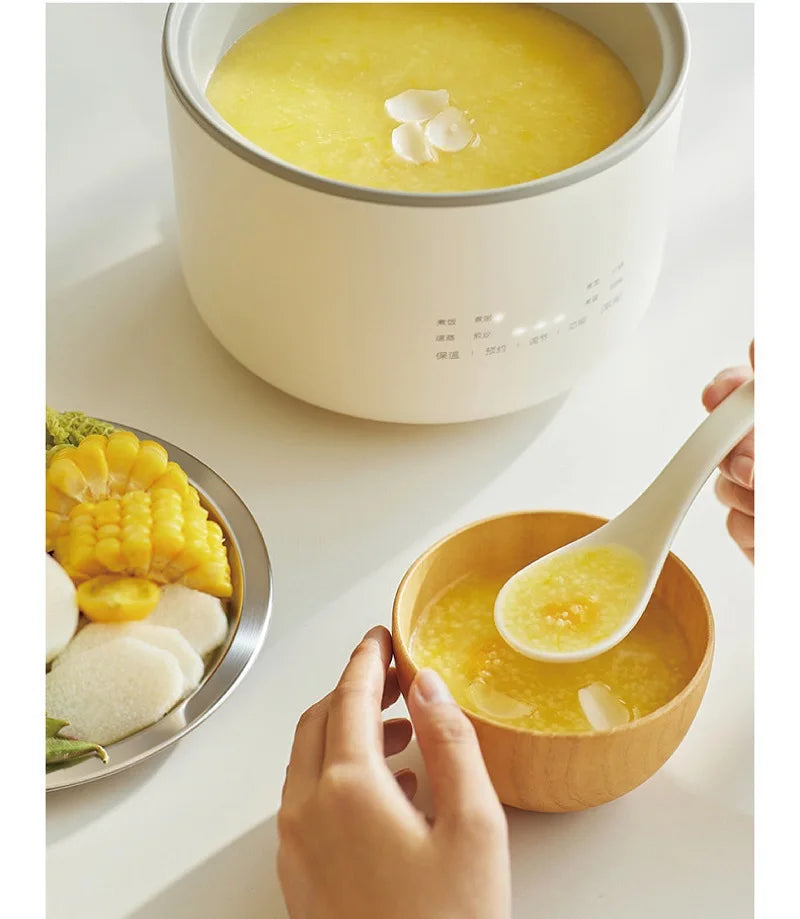 Smart white rice cooker pot with yellow soup, with ladle pouring into wooden bowl