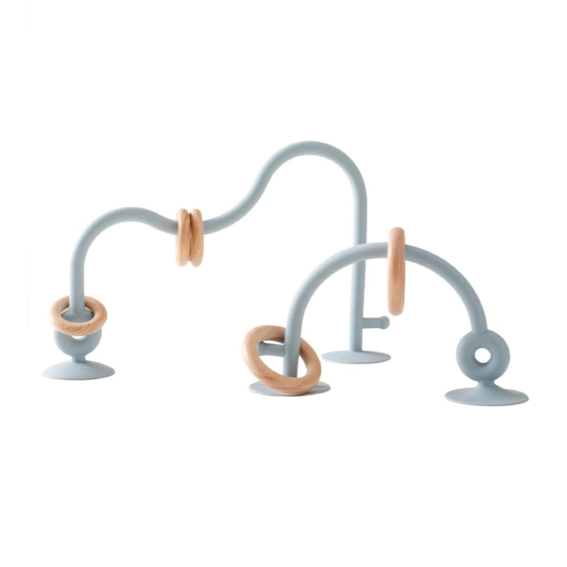 Blue silicone and natural wood baby teething toy rings for soothing relief.