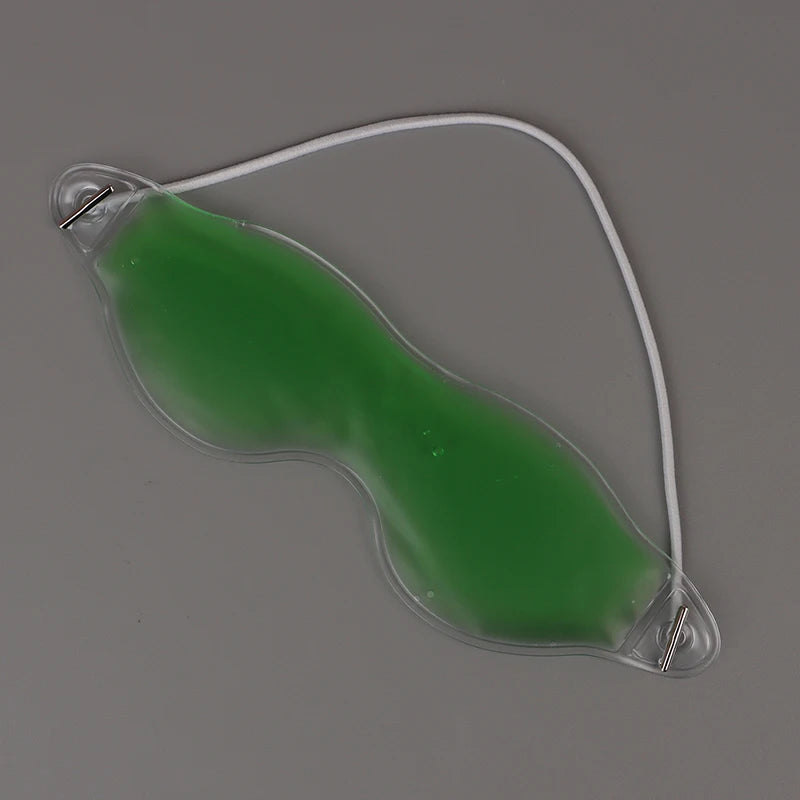 Green gel cold eye mask for sleep and cooling compress with elastic strap for migraine and insomnia relief.