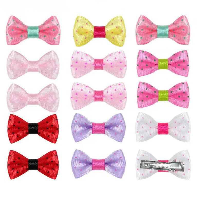 Colorful polka dot ribbon bow hair clips for small dogs and cats, perfect for stylish pet grooming and styling.
