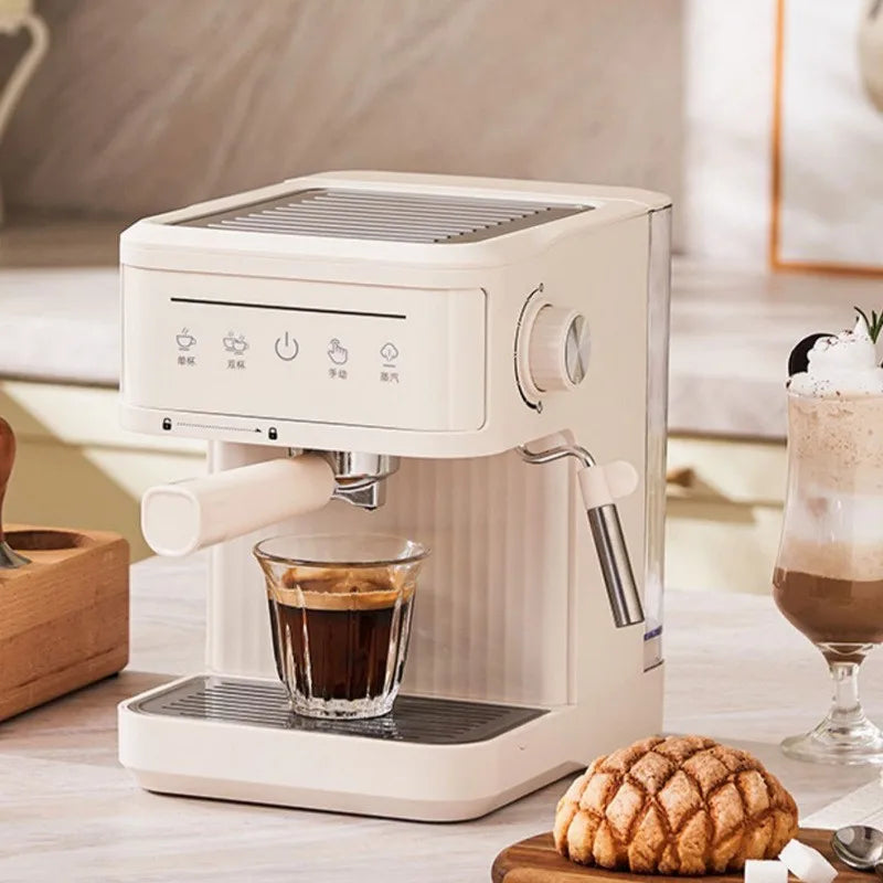Compact cream-colored espresso machine with touch display, steam wand, and removable drip tray on a kitchen counter.