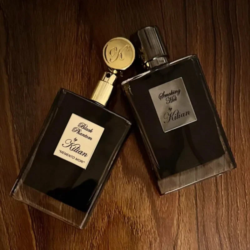 Kilian Black Phantom & Smoking Hot EDP: Unisex niche fragrance, warm spicy woody scent in luxury rectangular bottles.