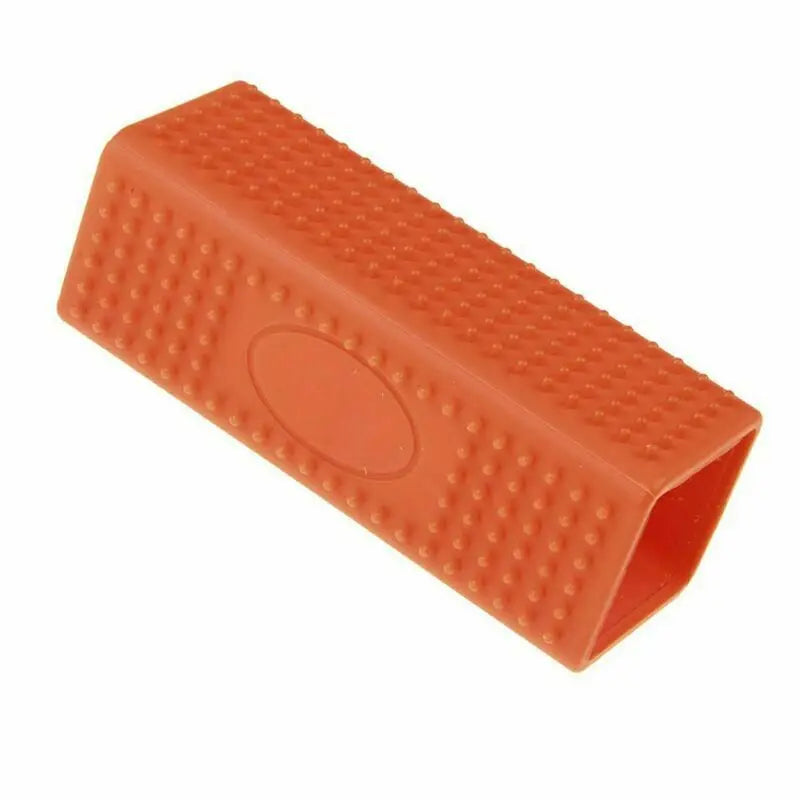 Orange silicone pet hair removal brush for effective dog and cat fur cleaning from furniture and clothes.