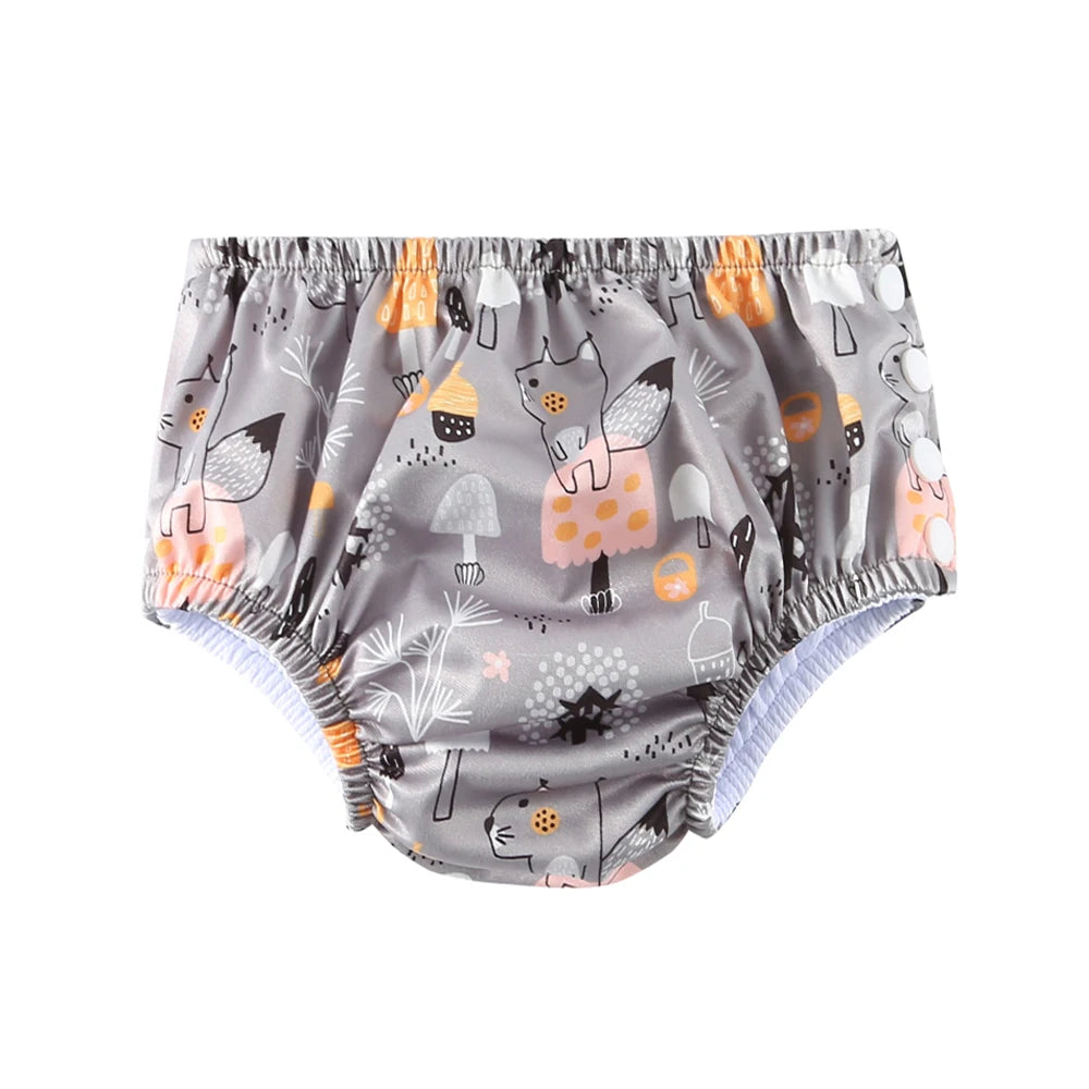 Reusable baby swim diaper in gray with cute fox and mushroom print, elastic waistband for comfortable baby care.