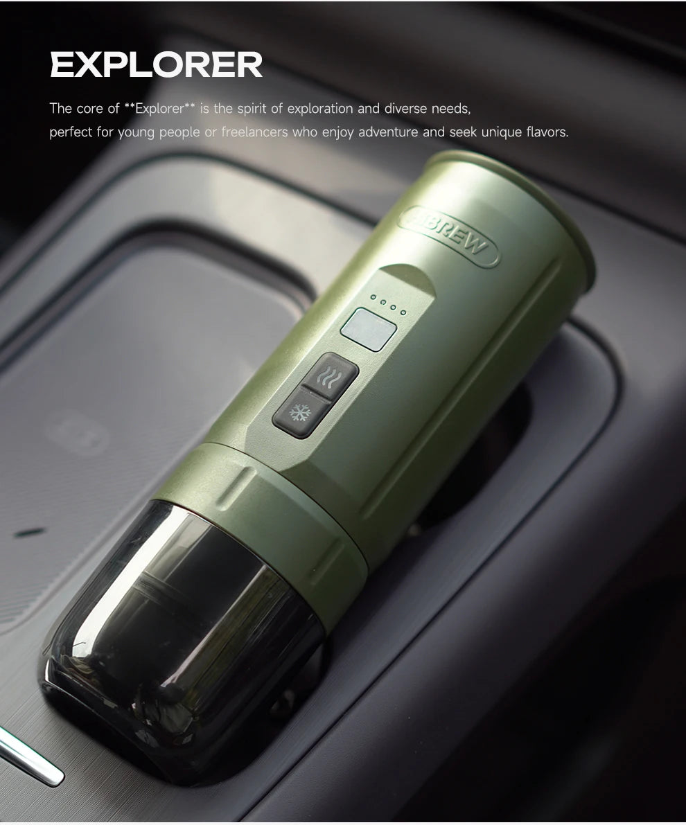 Olive green portable ABREW Explorer coffee maker with hot and cold settings in a car cup holder.