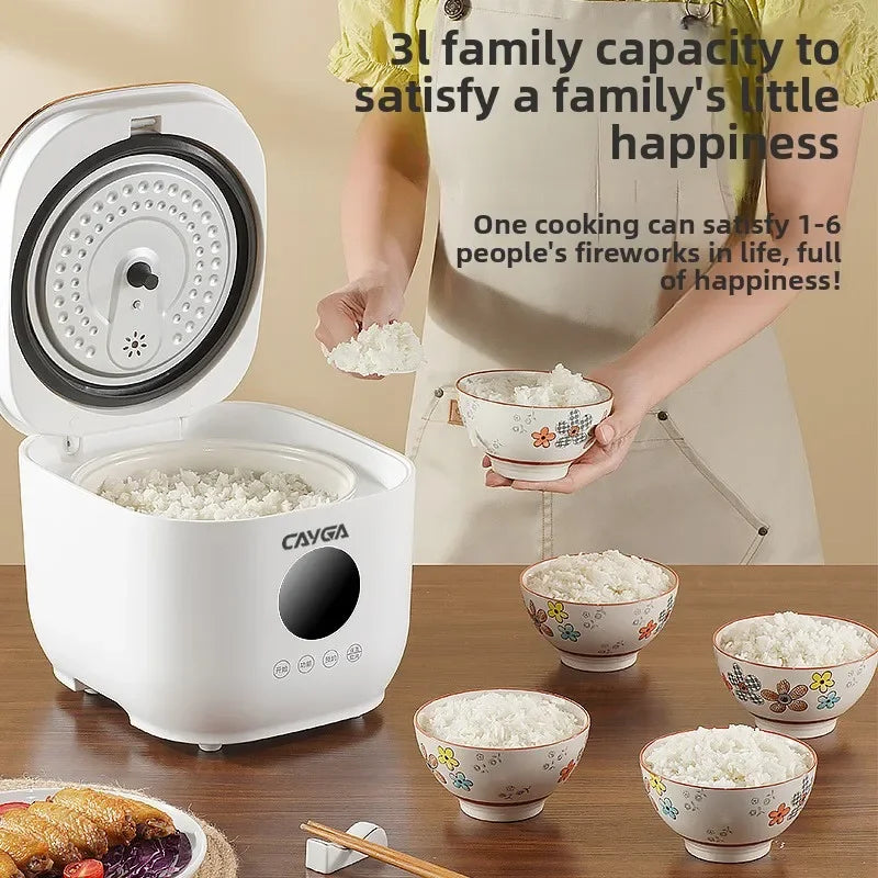 White rice cooker with open lid and perforated steaming basket in ceramic inner pot