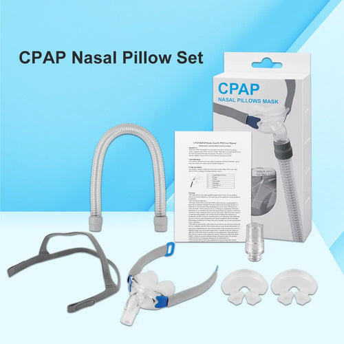 CPAP nasal pillow mask set with grey headgear, clear hose, and accessories for sleep apnea therapy.