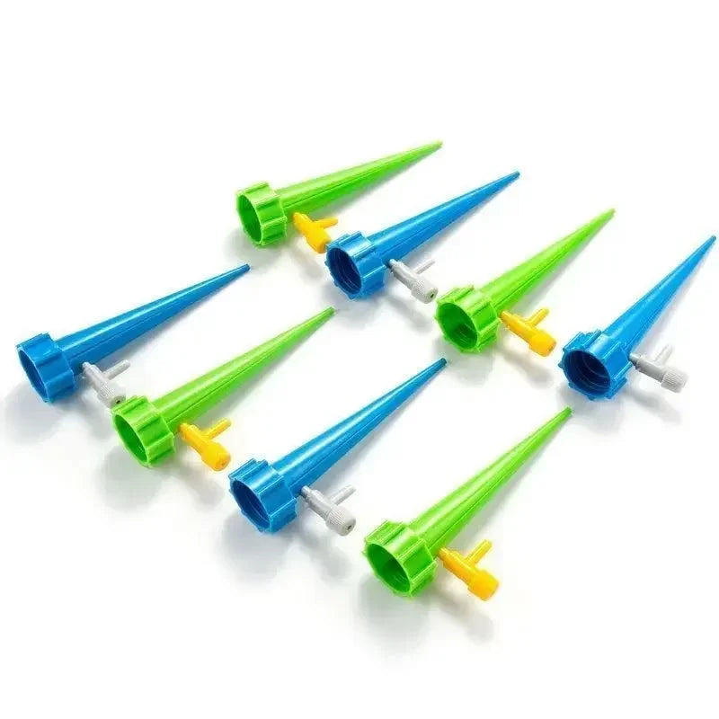 Automatic drip irrigation stakes set with green and blue drippers and small valves