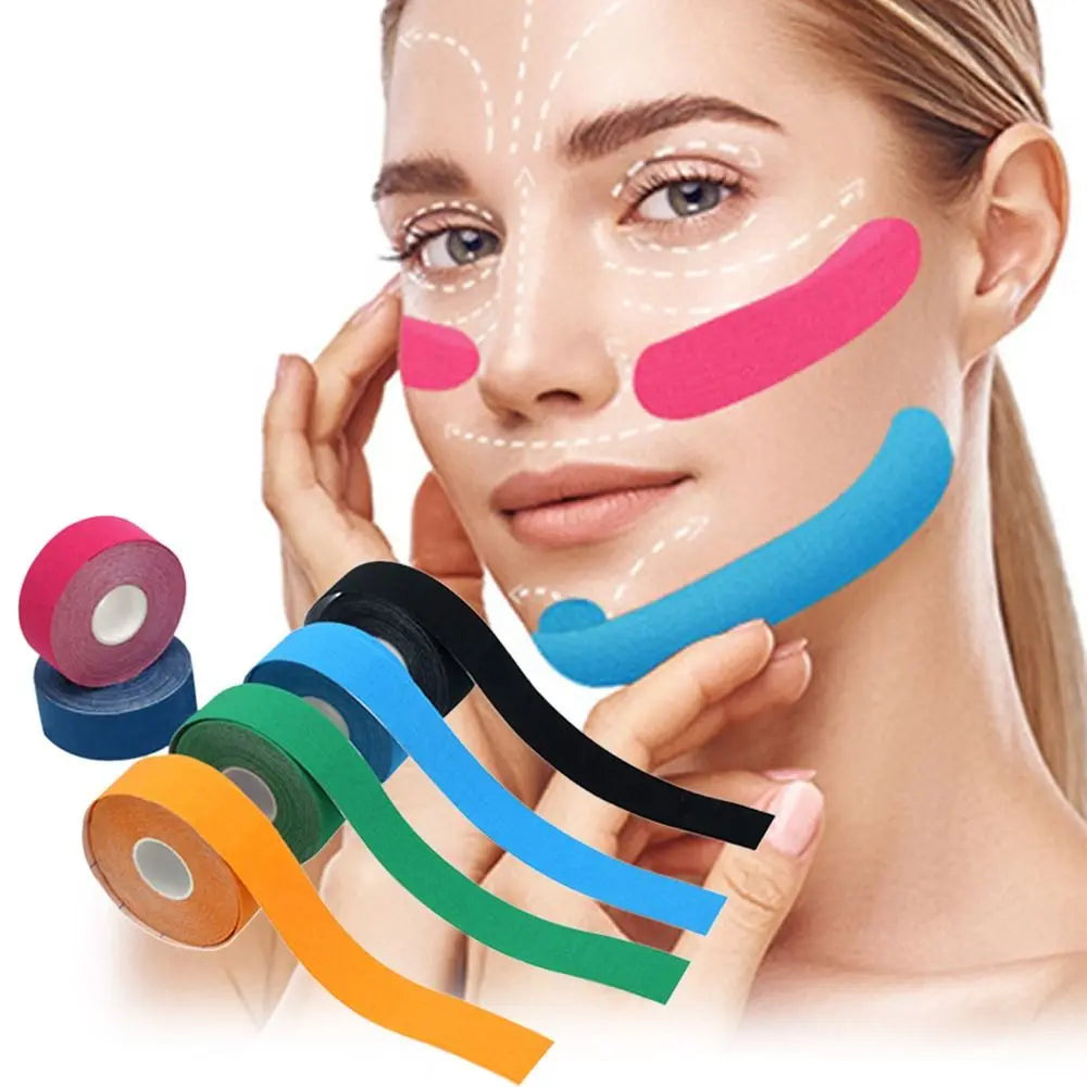 Woman with multicolored lifting face tape applied to cheeks and jawline, next to rolls of assorted colored facial tape.