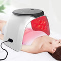 7-color PDT LED light therapy facial device for skin rejuvenation and acne treatment used while lying down.