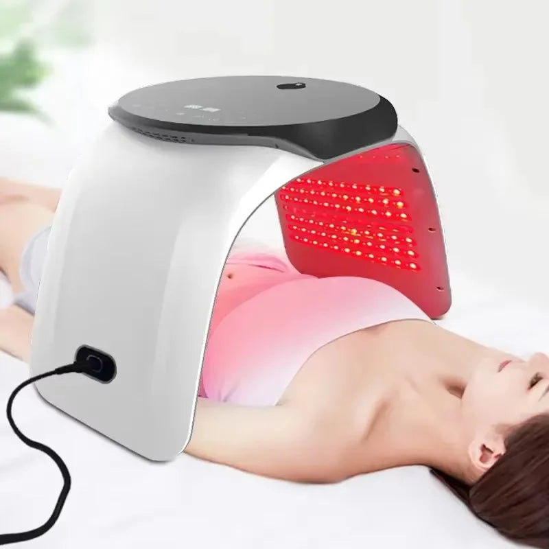 7-color PDT LED light therapy facial device for skin rejuvenation and acne treatment used while lying down.