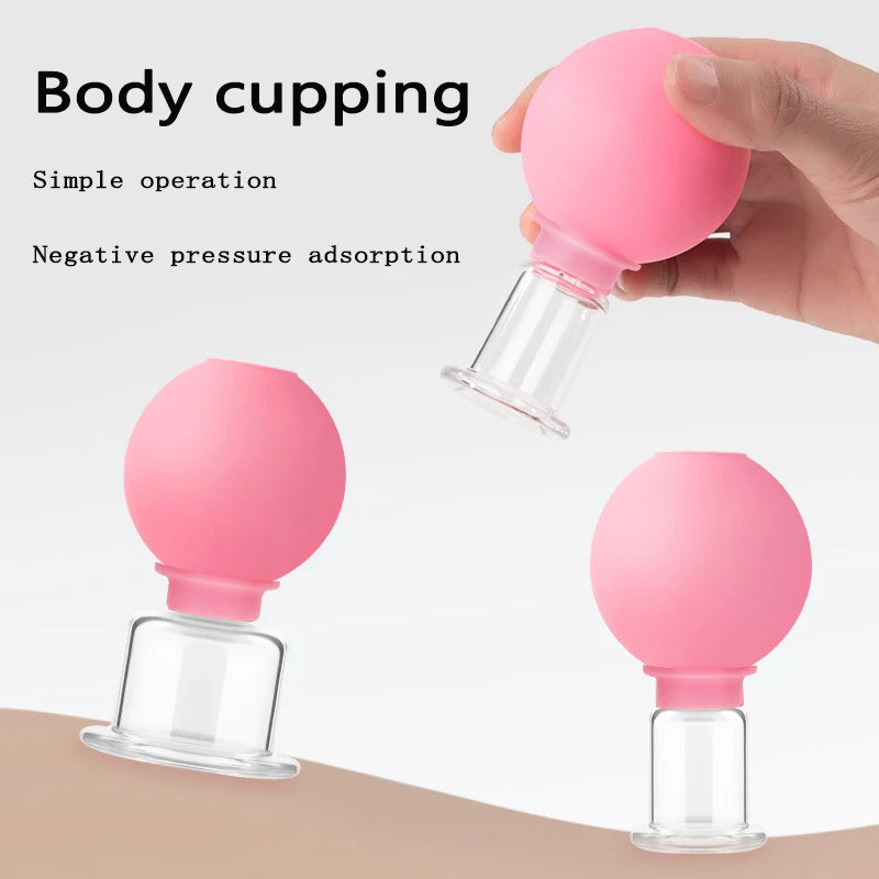 Three pink rubber and glass facial cupping massage tools shown with a hand demonstrating the suction application.