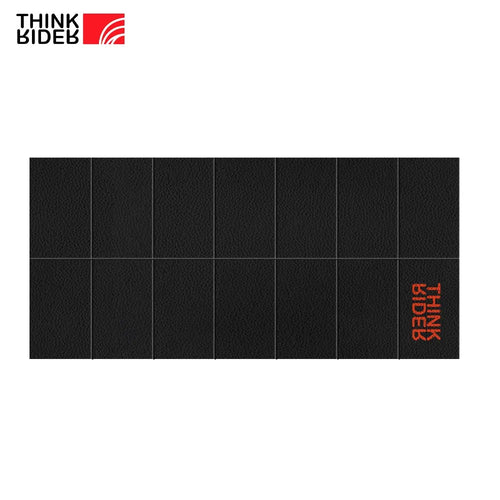 ThinkRider training mat, smart yoga mat for indoor bike trainers and exercise bikes, black floor protection top view.